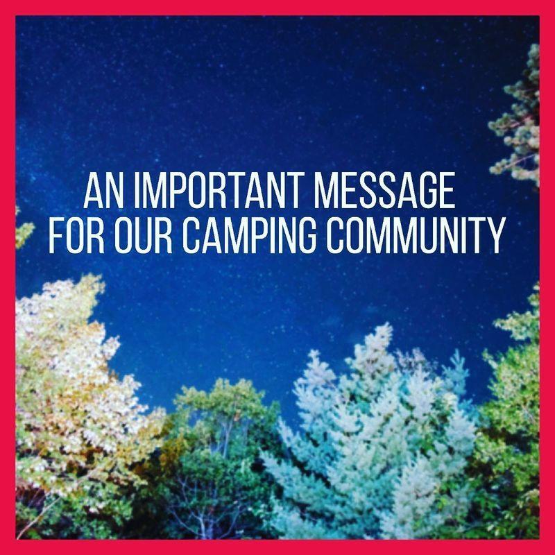 Nighttime treeline with 'An Important Message for our Camping Community' written in the sky