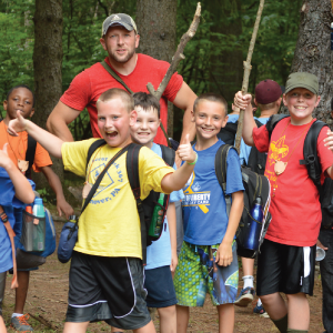 A group of boys and a man smiling